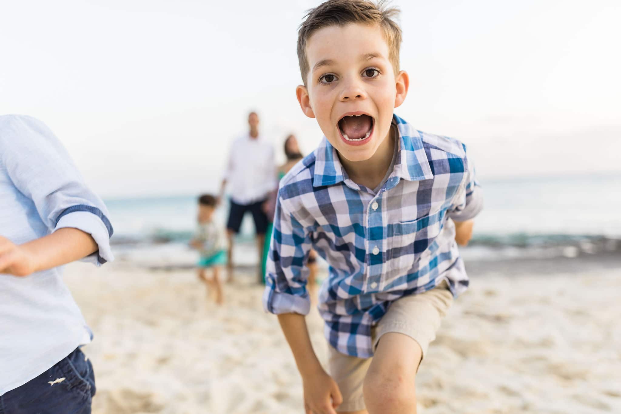 Family photo session on the beach by Heather Johnson Photography